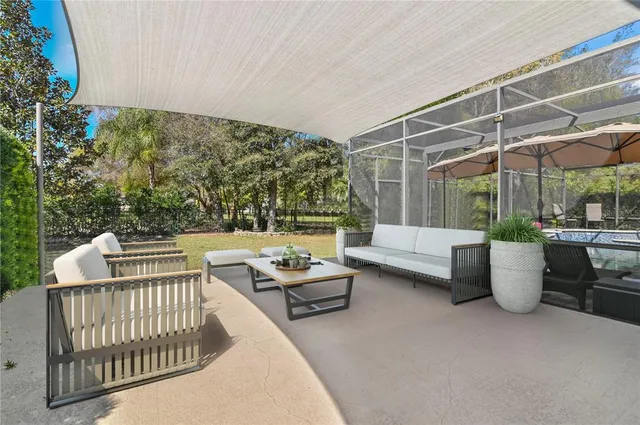 a view of a patio with couches and potted plants