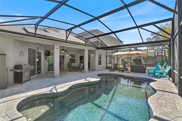 a view of a swimming pool with a patio
