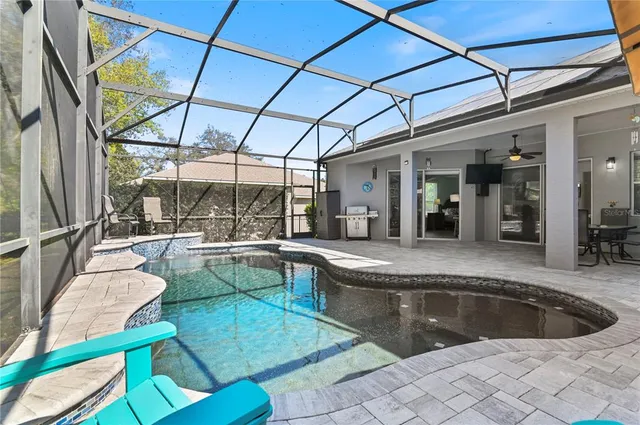 a large white kitchen with a large window