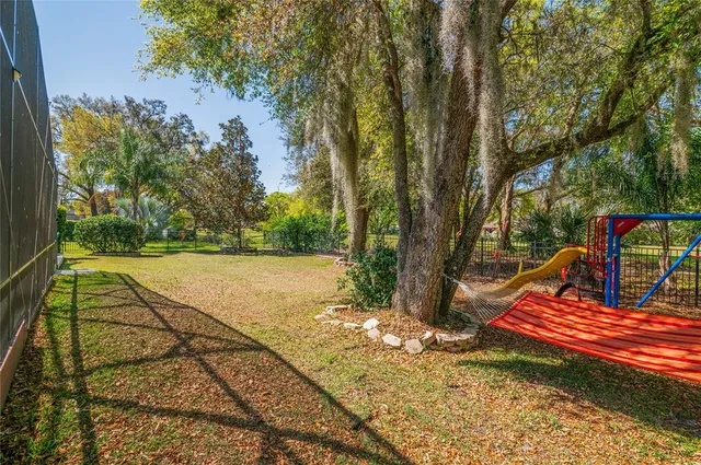 a view of swimming pool with a patio