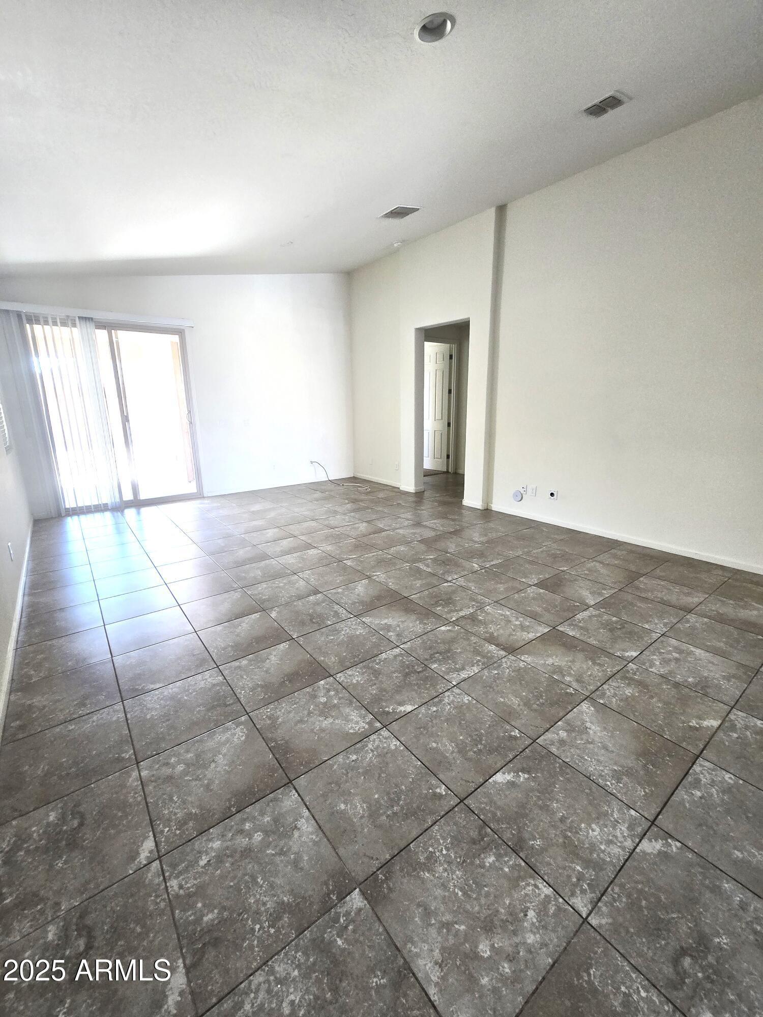 3931 East Narrowleaf Drive Gilbert, AZ 85298 - Photo 4 of 7 a view of an empty room with windows