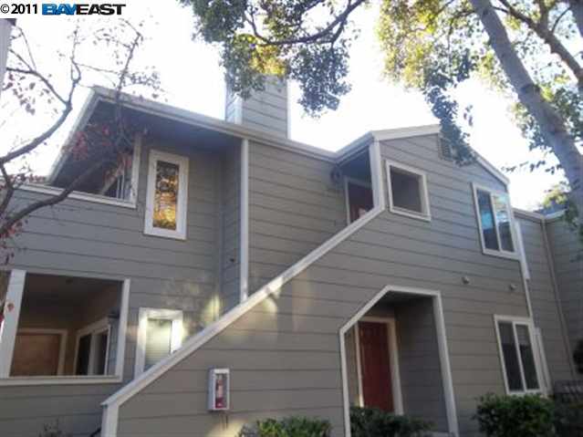 a view of house with a tree