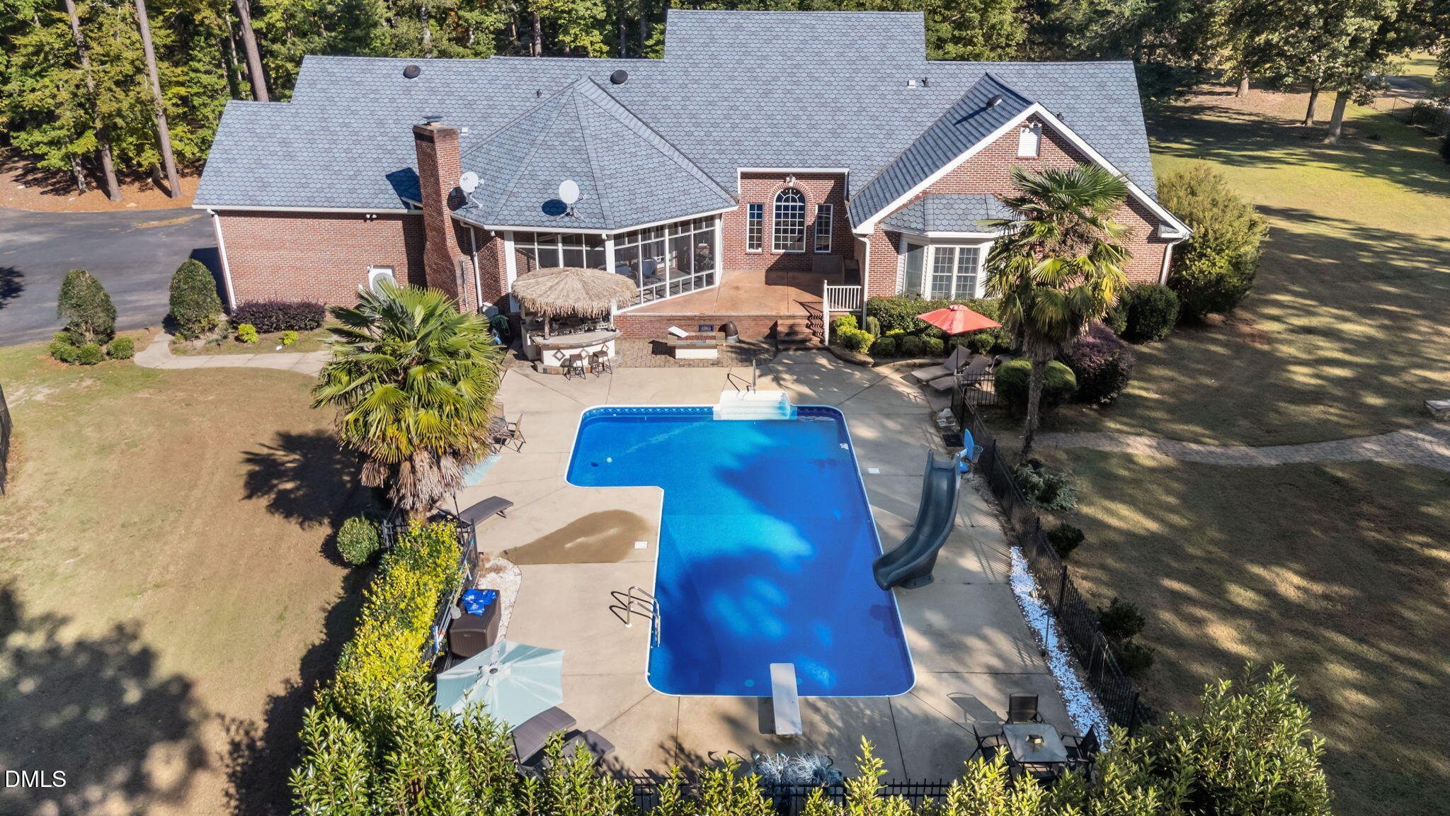 5870 Hoyt Road Middlesex, NC 27557 - Photo 7 of 33 an aerial view of a house with outdoor space pool seating area and lake view