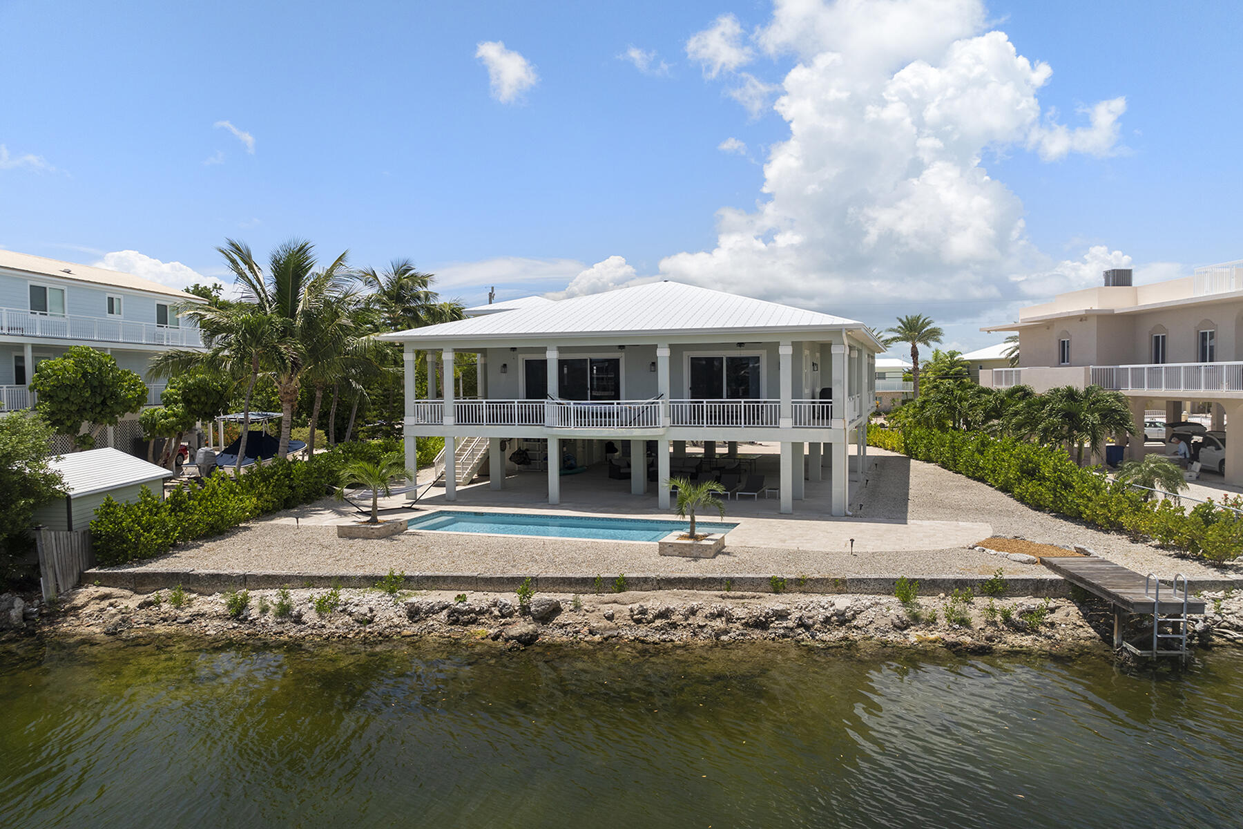 78 North Bounty Lane Key Largo, FL 33037 - Photo 3 of 68 a view of house with swimming pool and yard