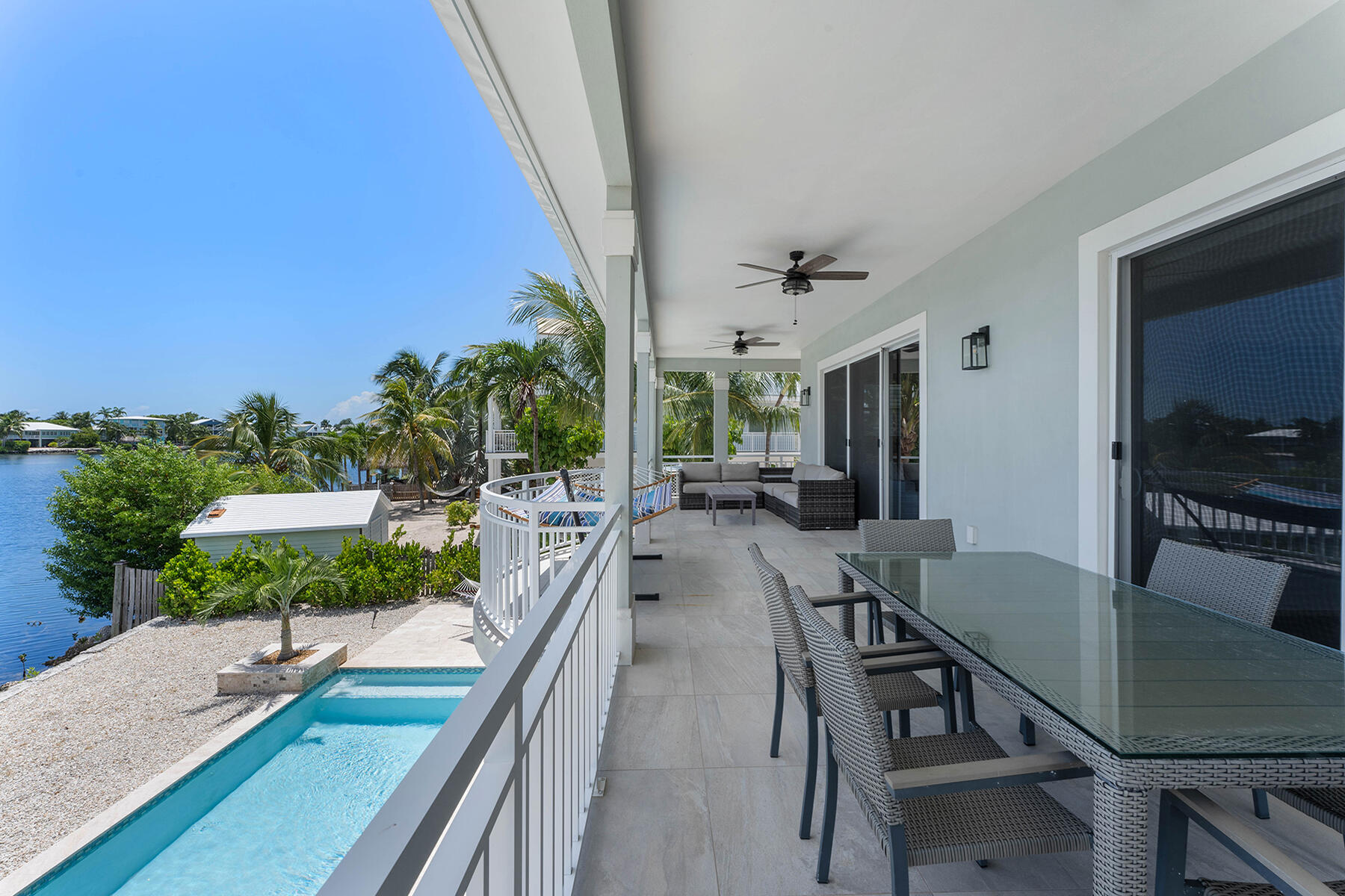 78 North Bounty Lane Key Largo, FL 33037 - Photo 34 of 68 a view of a dining room with furniture and a floor to ceiling window