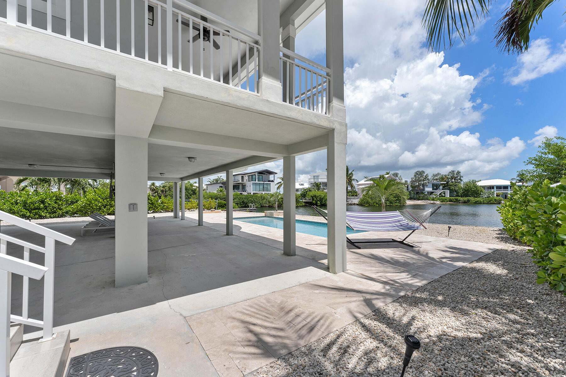 78 North Bounty Lane Key Largo, FL 33037 - Photo 39 of 68 a view of a patio with a table and chairs
