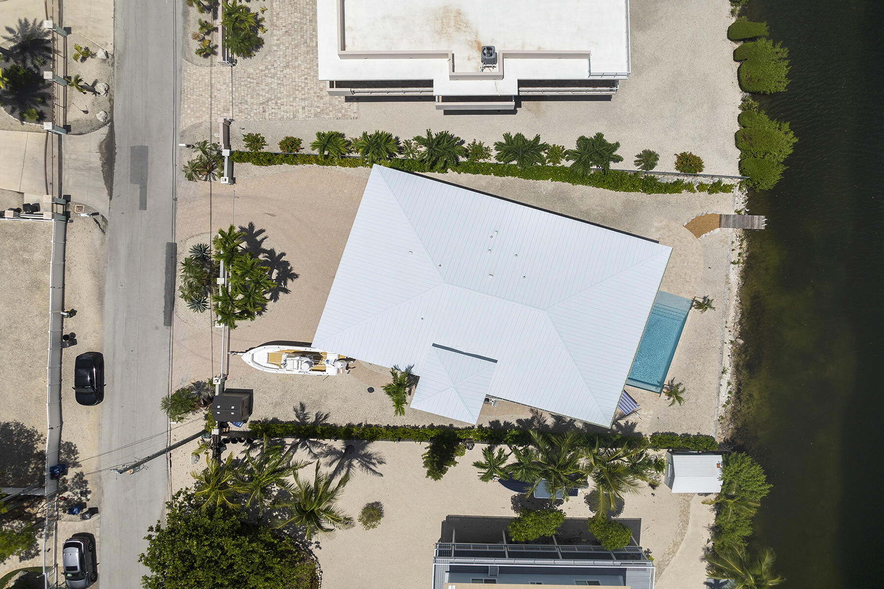 78 North Bounty Lane Key Largo, FL 33037 - Photo 44 of 68 an aerial view of a house with a yard wooden table and chairs