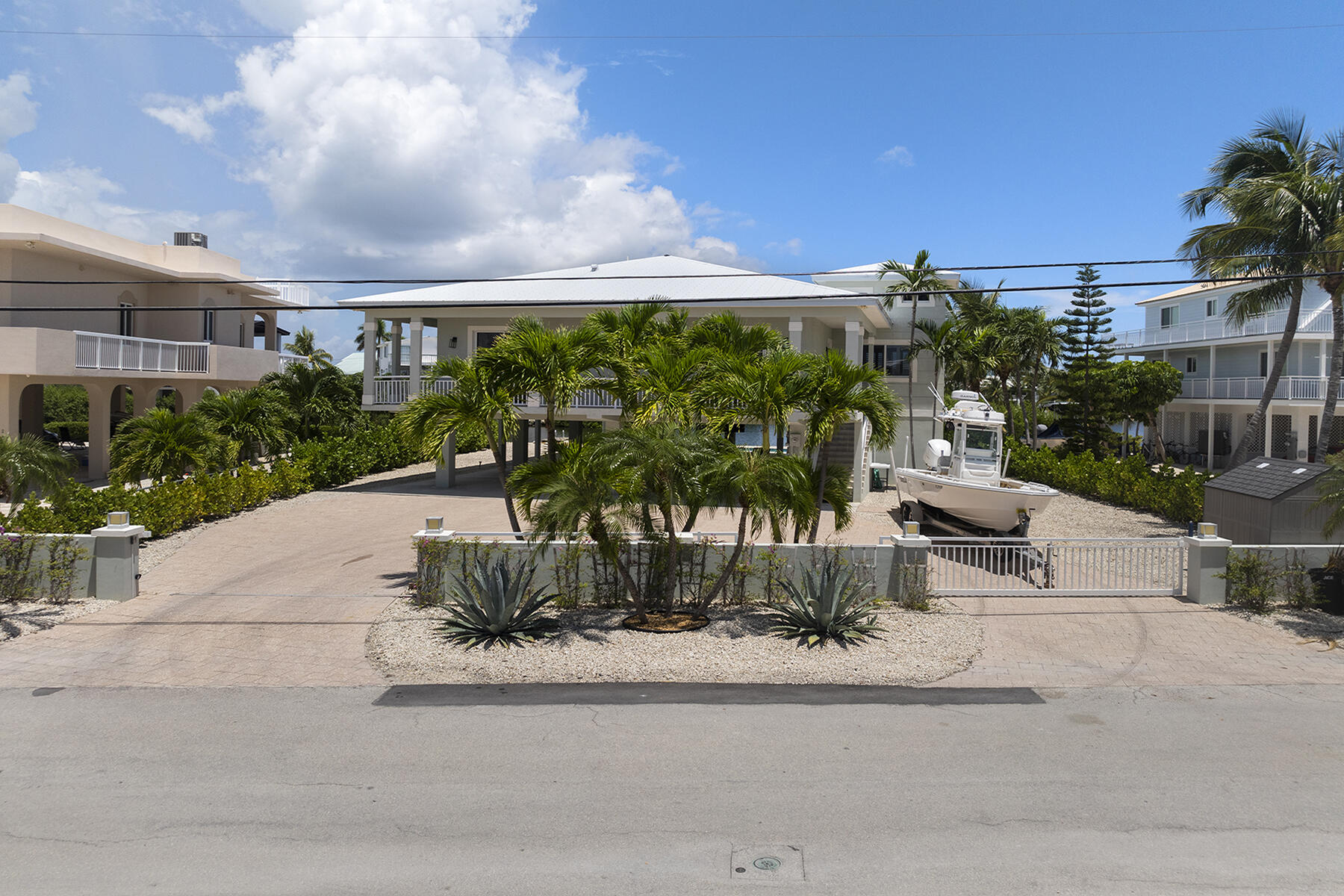 78 North Bounty Lane Key Largo, FL 33037 - Photo 50 of 68 a view of a patio with table and chairs potted plants with floor to ceiling window and potted plants