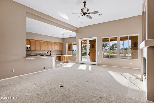 a large kitchen with stainless steel appliances granite countertop a stove and a sink