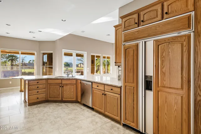 a spacious bedroom with a bed and a window