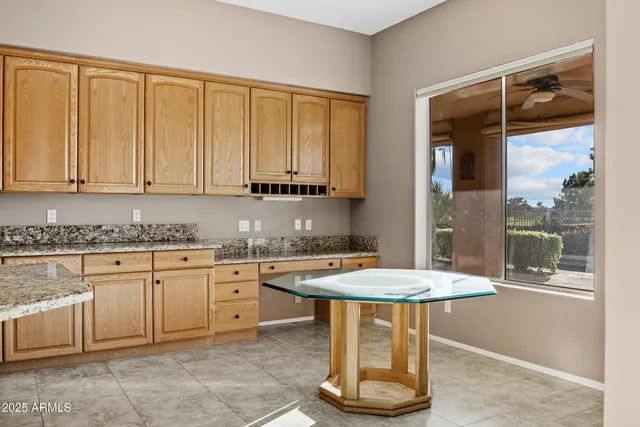 a large spacious bathroom with a granite countertop tub shower and sink