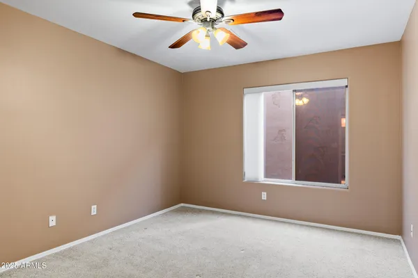 a view of a backyard with plants and swimming pool