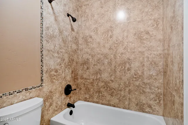 a view of a patio with couches chairs and potted plants