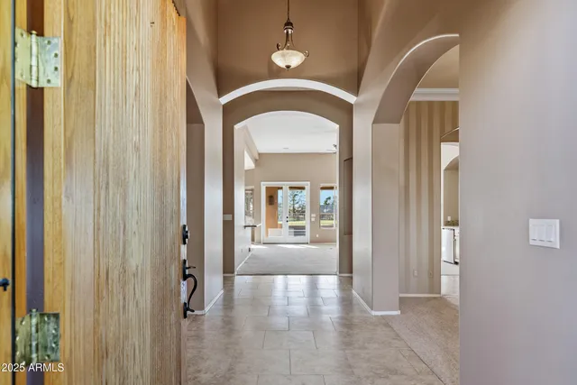 a view of a livingroom with furniture and a chandelier