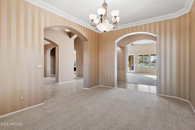 a view of an empty room with a fireplace
