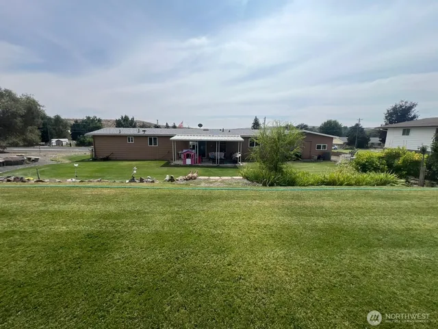 a aerial view of a house with a yard