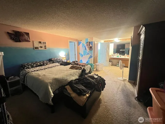 a bathroom with a toilet and a window