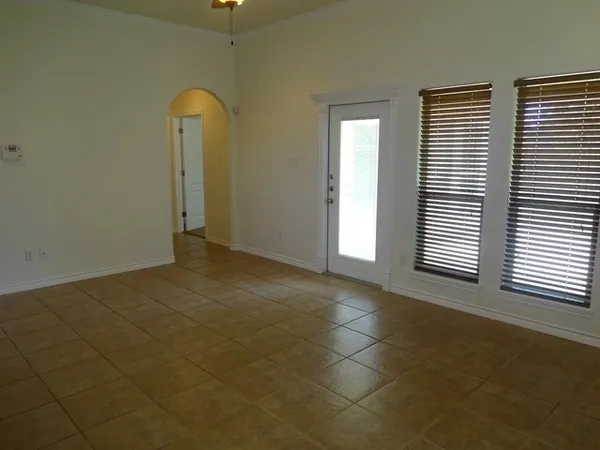 a view of an empty room with a window