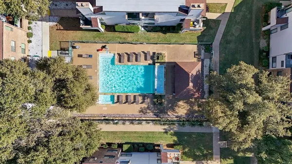 an aerial view of a house with a garden