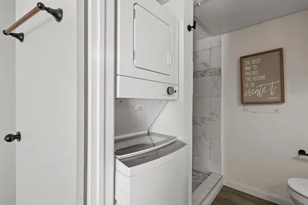 a bathroom with a shower and toilet