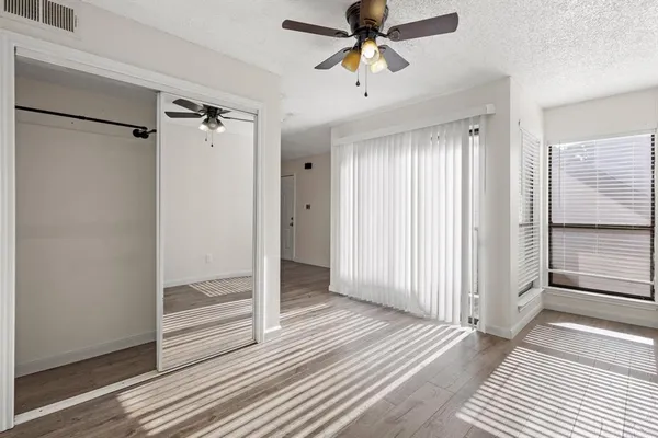a view of a room with wooden floor and staircase