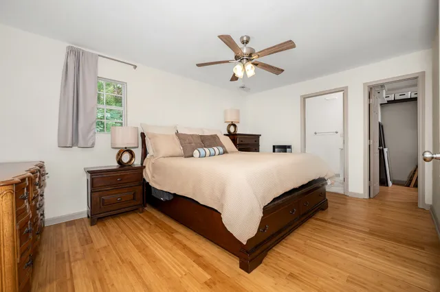 a bed room with a bed and a chandelier