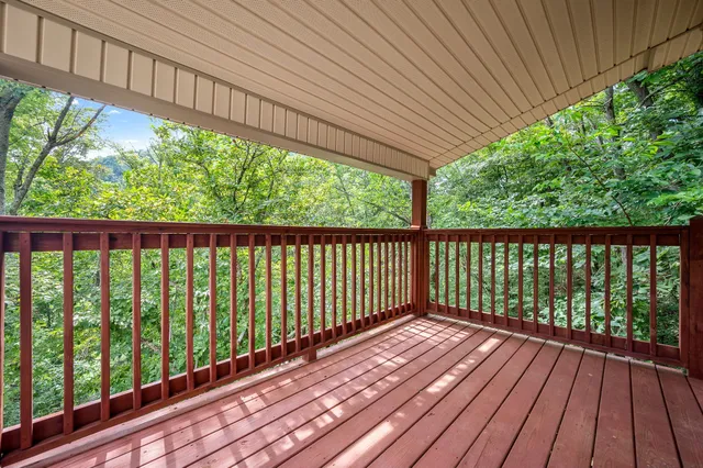 a view of balcony with wooden floor