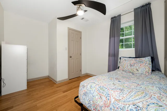 a bedroom with a bed and a window