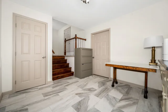 a room with a dresser and a wooden floor