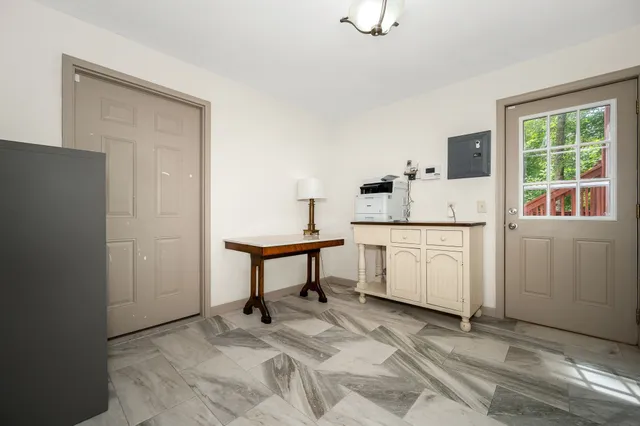 a view of kitchen with white cabinets and white appliances