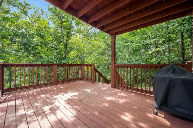 a view of a backyard with wooden floor and outdoor space