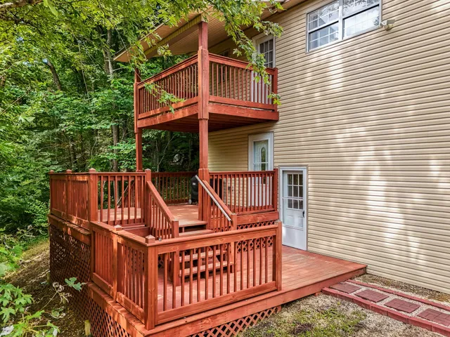 a view of balcony with deck and wooden floor