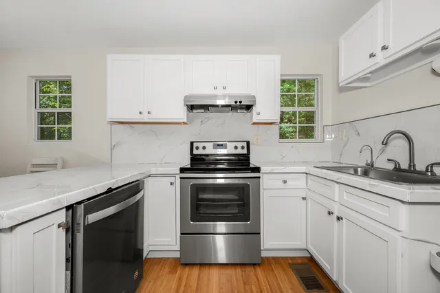 a kitchen with a stove and a sink