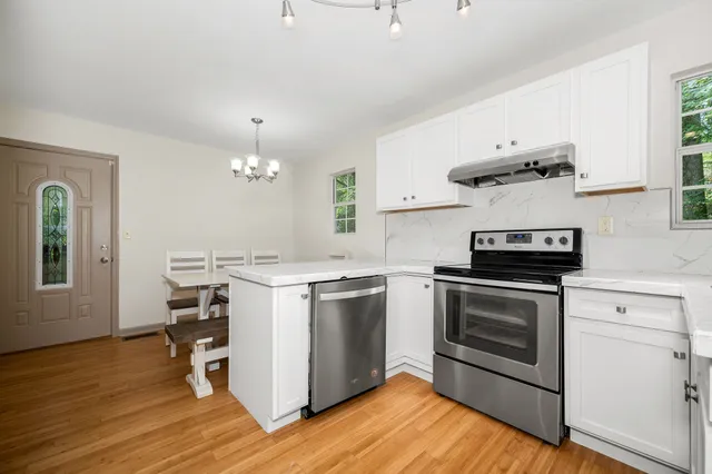 a kitchen with a stove and a microwave