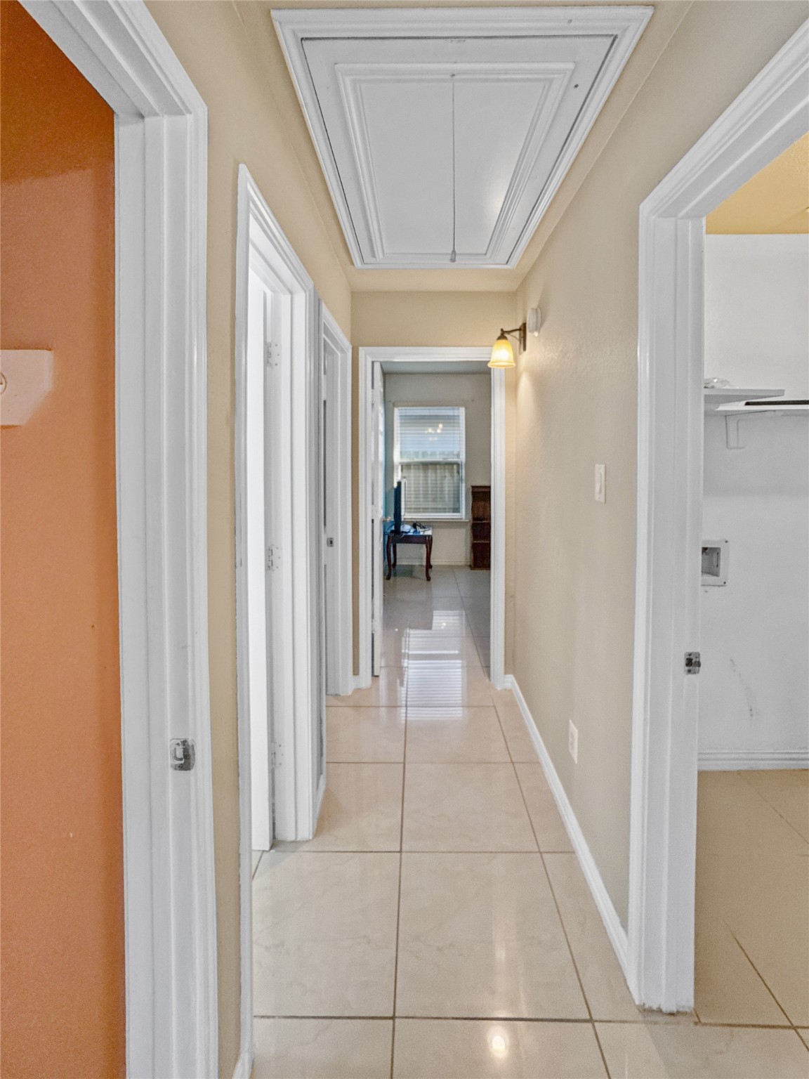6614 Pine Tree Springs Houston, TX 77049 - Photo 12 of 14 a view of a hallway with a livingroom and a bathroom