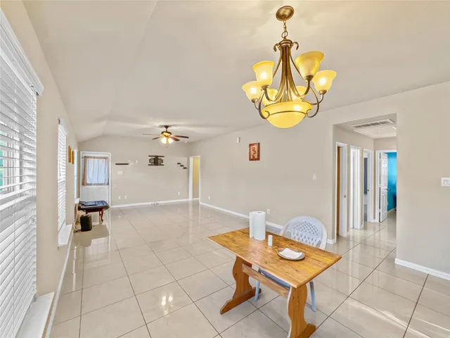 a room with table and chairs