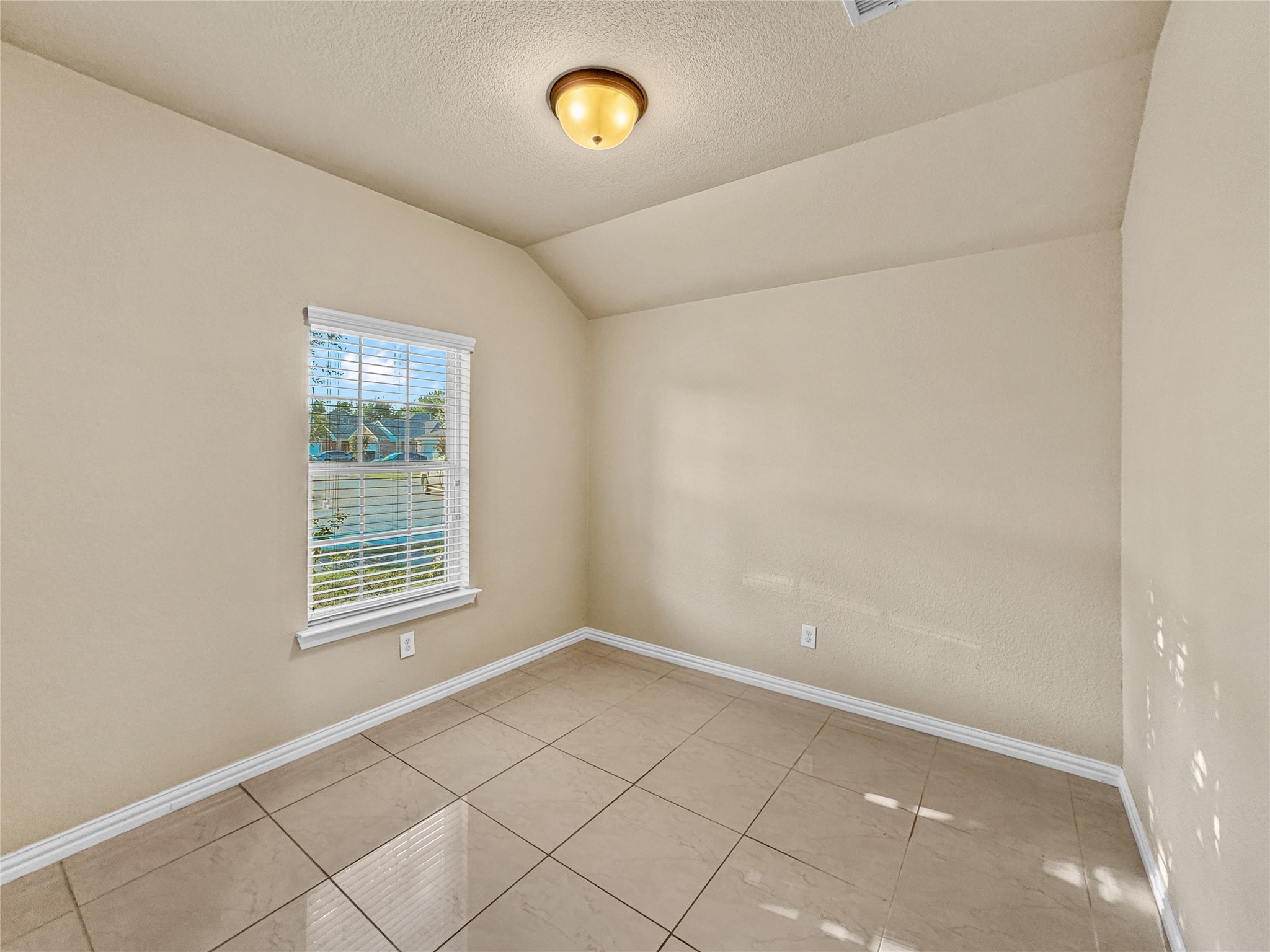 6614 Pine Tree Springs Houston, TX 77049 - Photo 5 of 14 an empty room with a empty space and a window