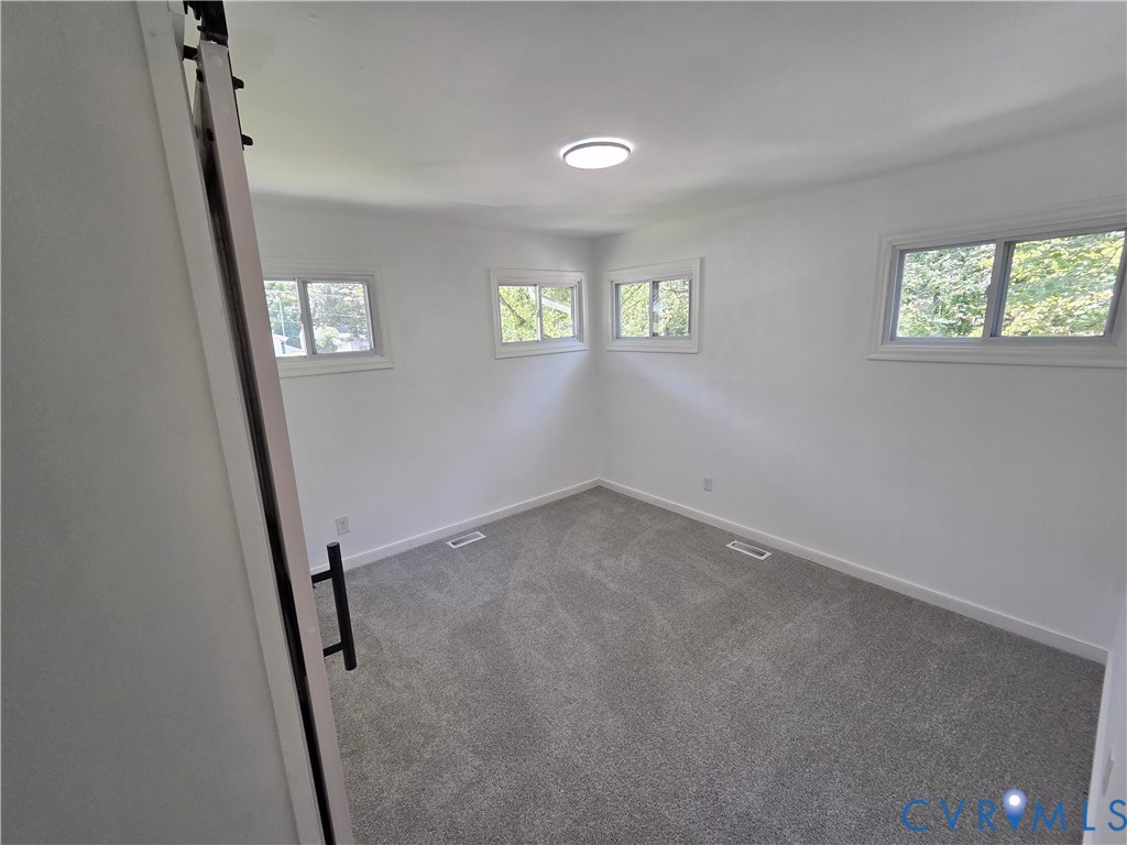 3918 Wood Dale Road Chester, VA 23831 - Photo 13 of 28 an empty room with windows