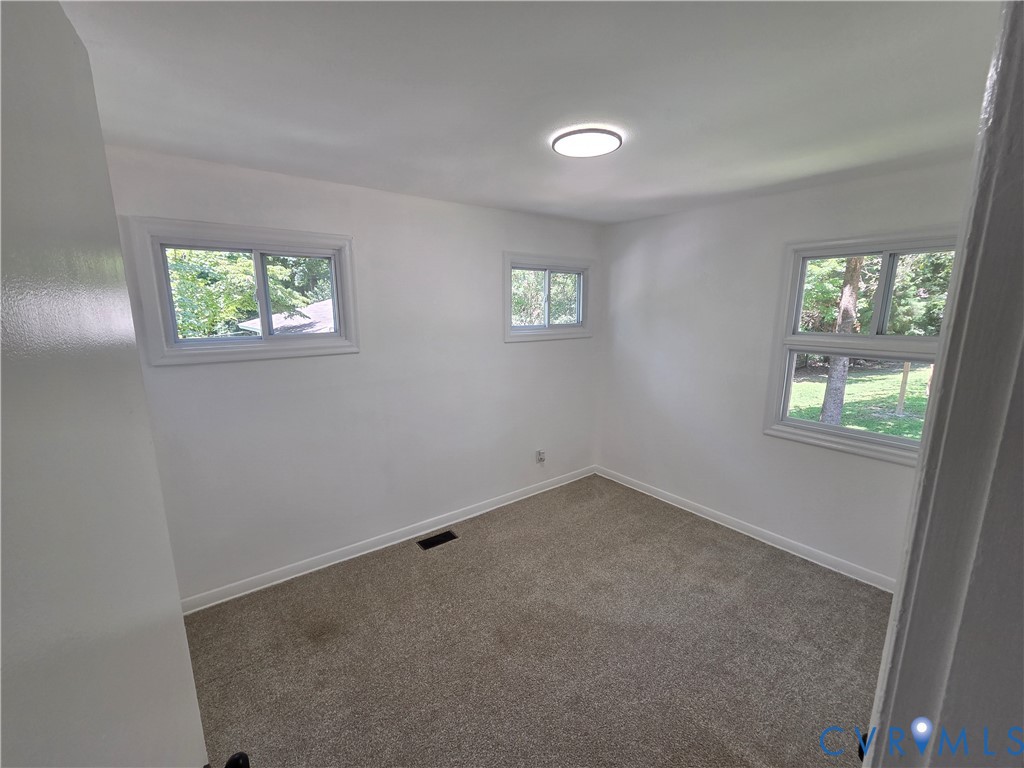 3918 Wood Dale Road Chester, VA 23831 - Photo 15 of 28 an empty room with windows
