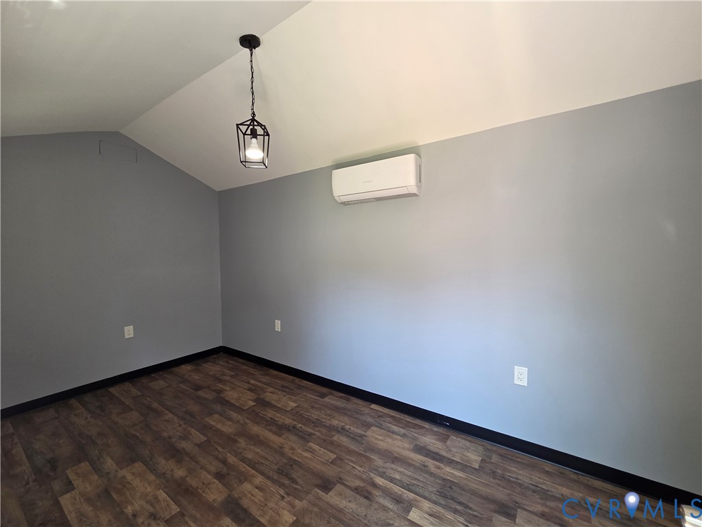 3918 Wood Dale Road Chester, VA 23831 - Photo 23 of 28 a view of a room with wooden floor and white walls