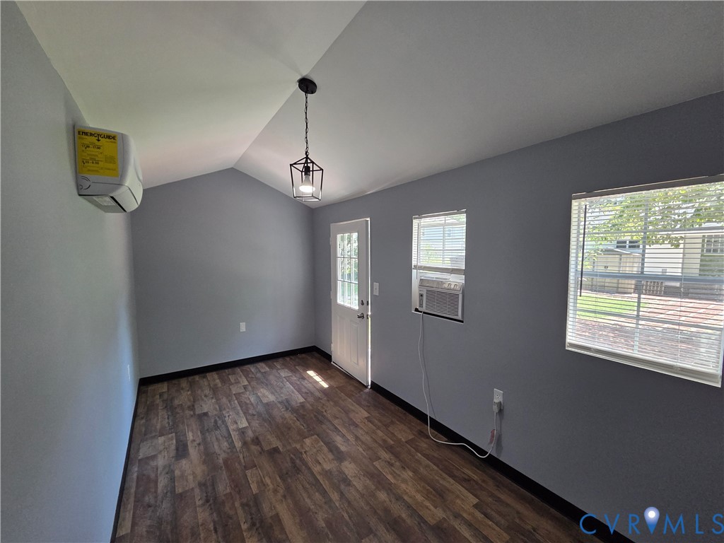 3918 Wood Dale Road Chester, VA 23831 - Photo 24 of 28 a view of an empty room with wooden floor and a window