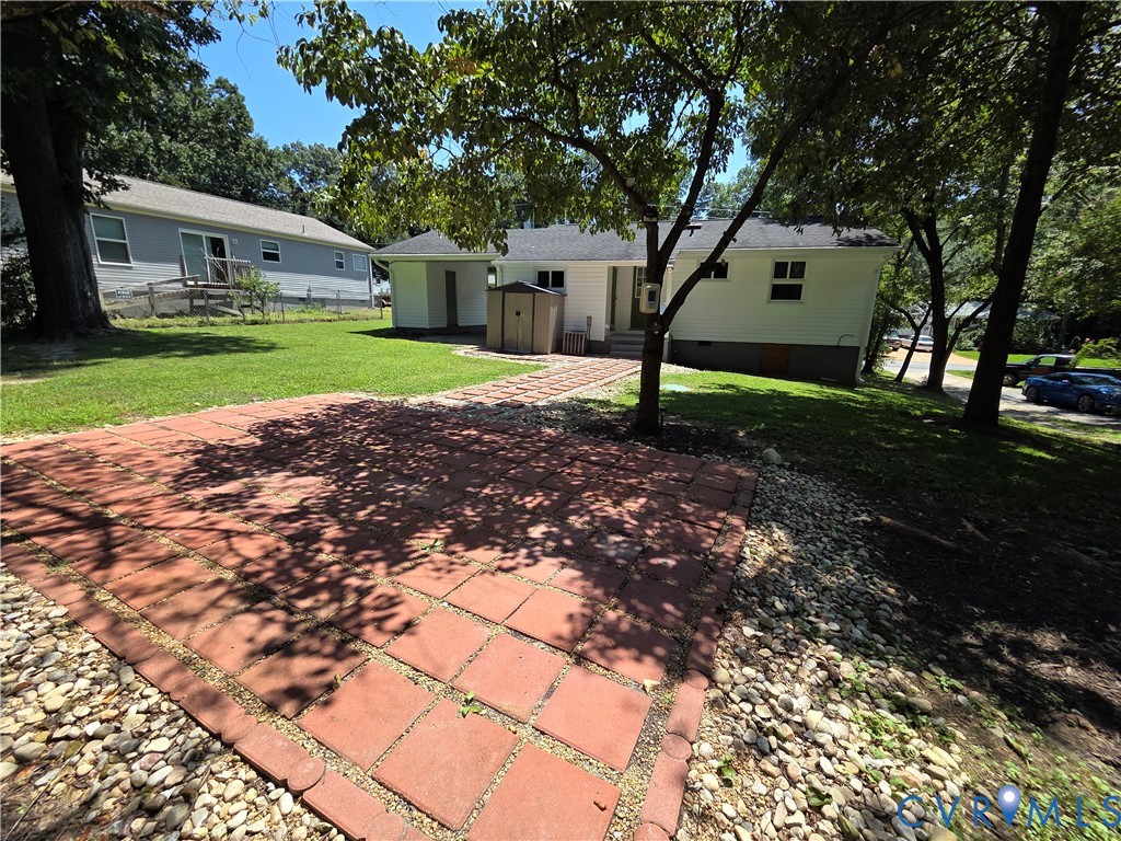 3918 Wood Dale Road Chester, VA 23831 - Photo 25 of 28 a view of a yard with plants and a large tree