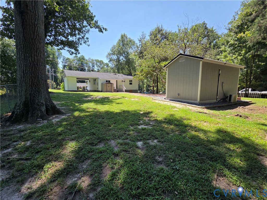 3918 Wood Dale Road Chester, VA 23831 - Photo 26 of 28 a view of a backyard with a garden