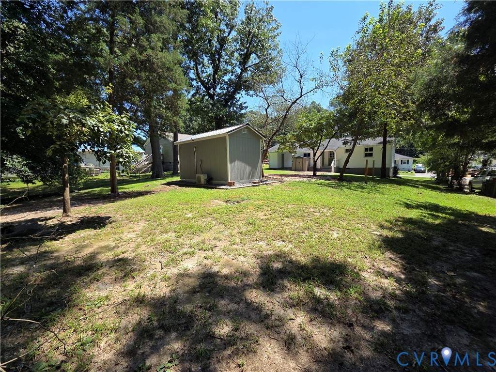 3918 Wood Dale Road Chester, VA 23831 - Photo 28 of 28 a view of a house with a yard