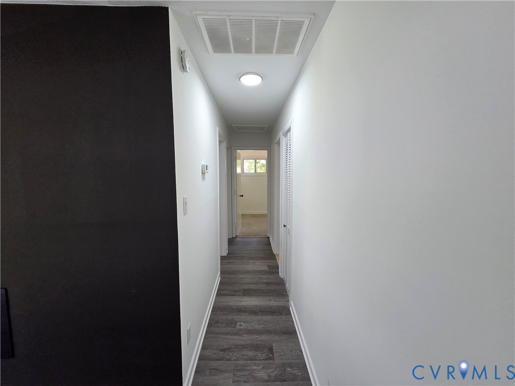 3918 Wood Dale Road Chester, VA 23831 - Photo 9 of 28 a view of a hallway with wooden floor