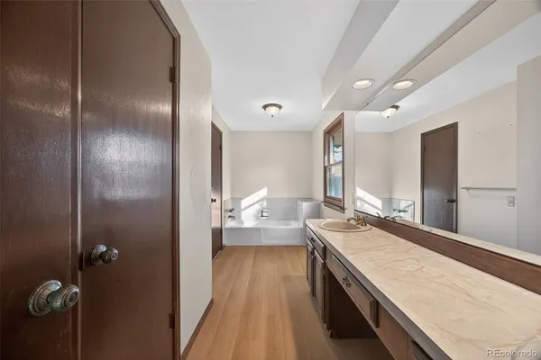 a bathroom with a glass shower door