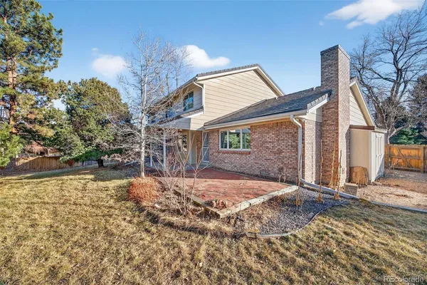 an aerial view of a house with a yard and garden