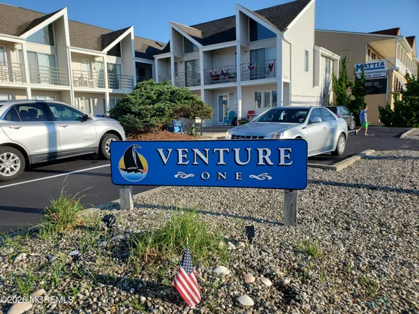 a front view of a house with parking space