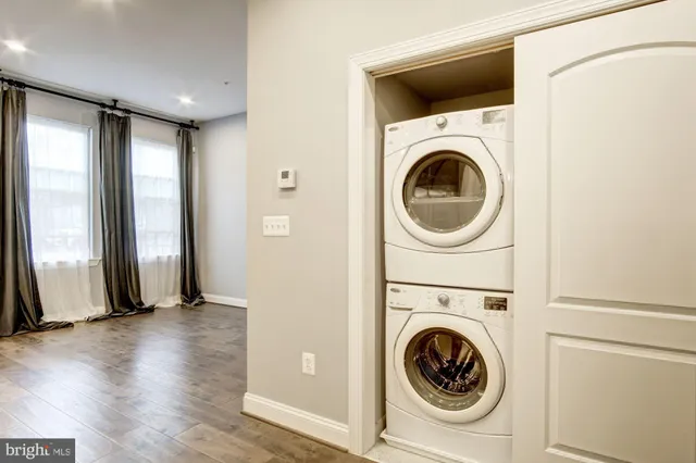 a view of a hallway with washer and dryer