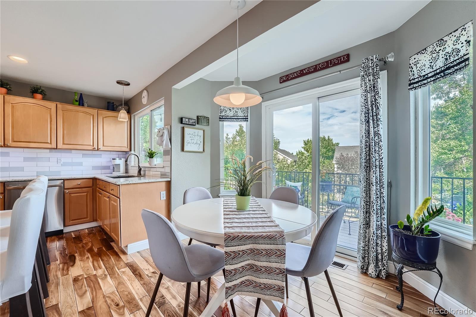 9538 La Quinta Drive Lone Tree, CO 80124 - Photo 14 of 41 a view of a dining room with furniture window and outside view